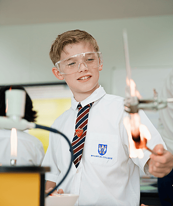 Boy conducting a science experiment with fire at Brighton College Vibhavadi, a top British curriculum school in Bangkok.