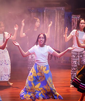 Pupils dancing on stage at Brighton College Vibhavadi, growing in confidence through expressive learning.