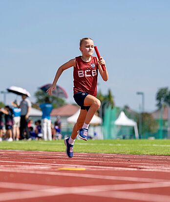 Girls running at Brighton College Vibhavadi, building self-confidence and physical strength through sport and movement.