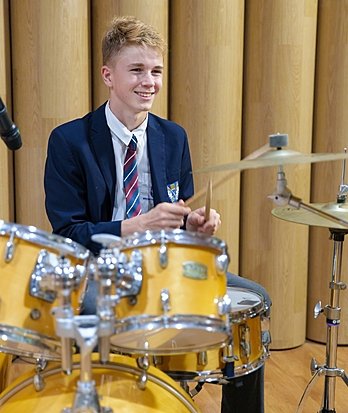 Sixth Form pupils engaging in music theory and performance at Brighton College Vibhavadi.