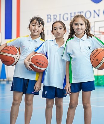 Prep pupils playing basketball at Brighton College Vibhavadi, developing teamwork and confidence through early years sport.