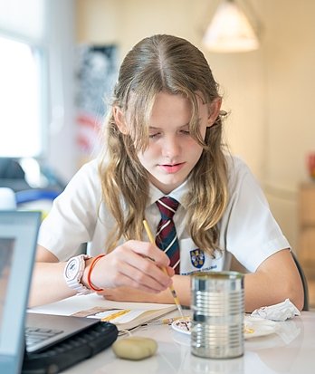 Pupils engaged in painting at Brighton College Vibhavadi, exploring creative expression through art education.