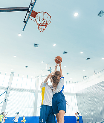 Pupils playing basketball during PE at Brighton College Vibhavadi, where physical education is part of holistic learning.