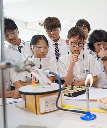 Science lesson with hands-on experiment at Brighton College Vibhavadi, promoting curiosity through STEM education.