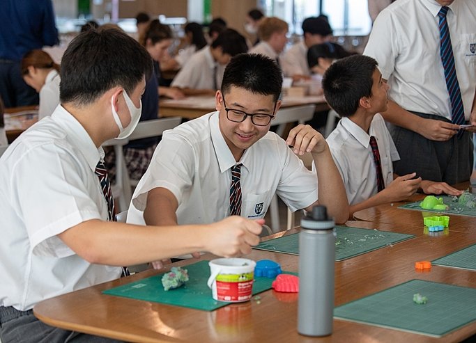  Pupils drawing in after-school club at Brighton College Vibhavadi, developing imagination and artistic skills in a supportive school environment. 