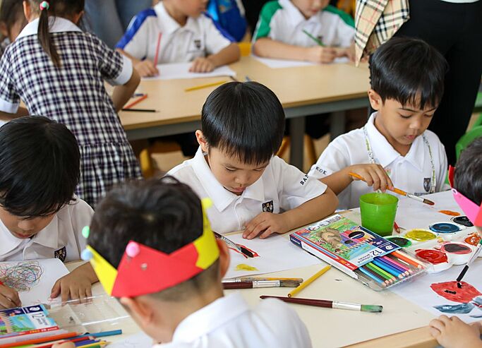  Nursery pupils painting during class at Brighton College Vibhavadi, enjoying hands-on learning through art and colour exploration. 