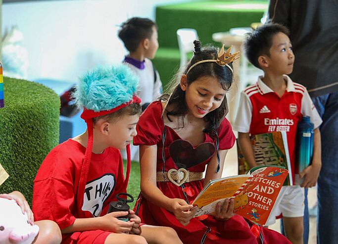  Pupil enjoying Reading Club at Brighton College Vibhavadi, where co-curricular activities support literacy and a love of learning. 