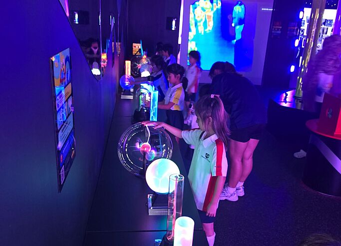  Pupil participating in a science field trip with Brighton College Vibhavadi, supporting STEM learning through discovery and observation. 