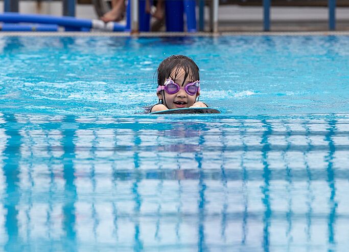  Pupil participating in Swimming Club at Brighton College Vibhavadi, developing physical confidence through after-school sport activities. 