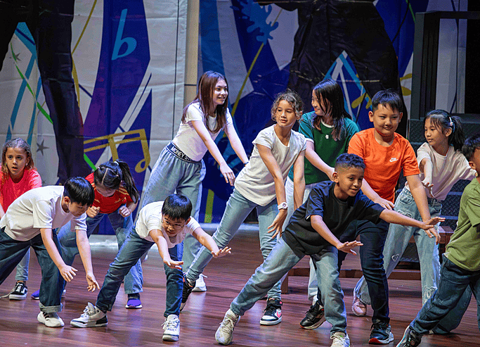  Senior pupils dancing confidently on stage at Brighton College Vibhavadi, reflecting the strength of performing arts in the curriculum. 