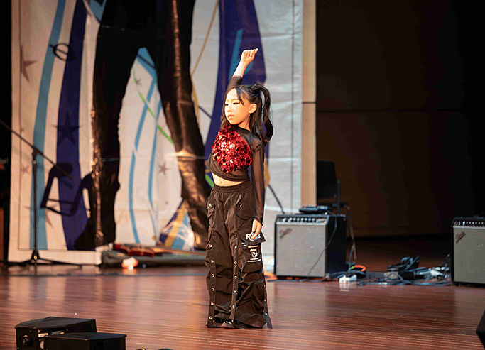  Pupil dancing solo on stage at Brighton College Vibhavadi, showcasing artistic talent in a premium international school in Thailand. 