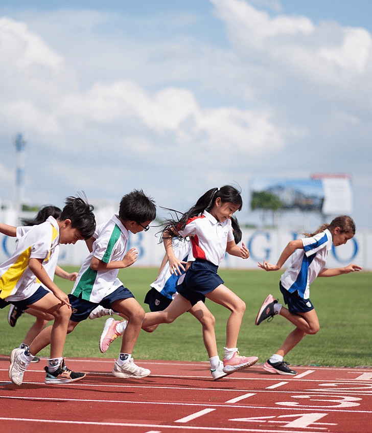  Pupils racing on the track during Open House at Brighton College Krungthep Kreetha, showcasing active and engaging school life in Thailand. 