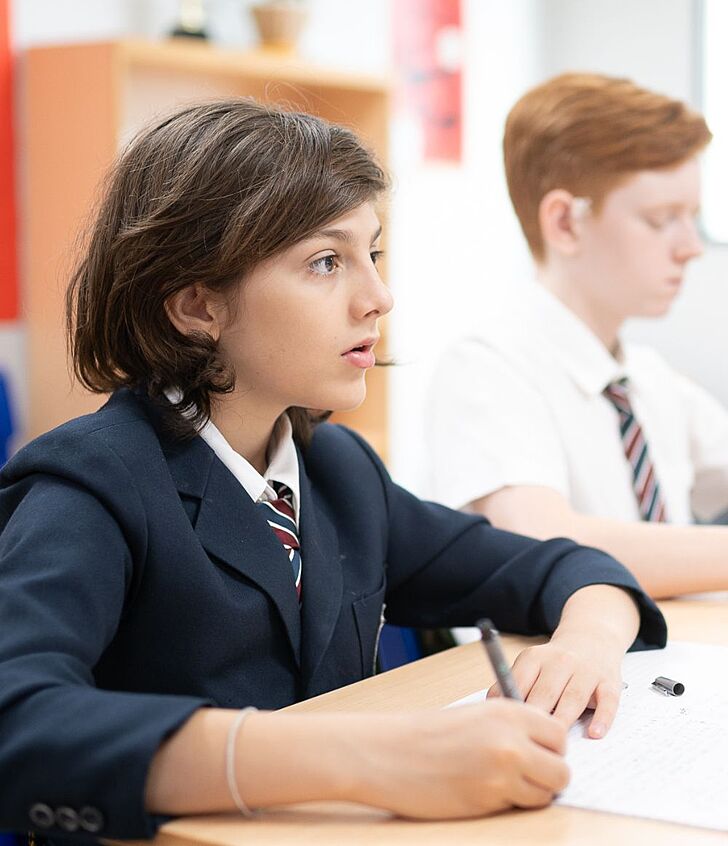  Focused pupil listening intently in class at Brighton College Vibhavadi, reflecting the school’s aim to nurture purpose-driven learners. 