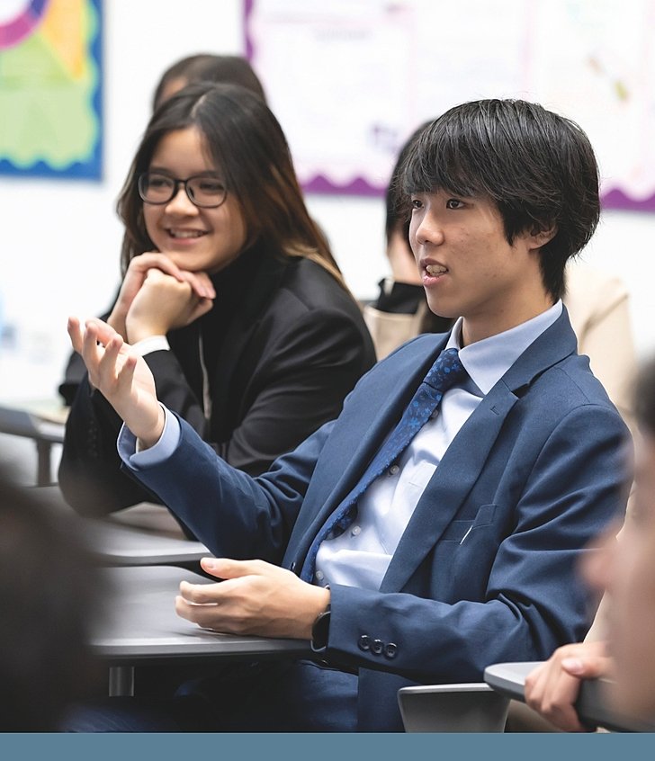  Sixth Form pupil confidently answering a question in class at Brighton College Vibhavadi, where learning encourages independence and self-expression. 