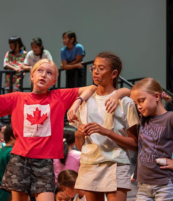  Pupils participating in drama club at Brighton College Vibhavadi, developing confidence and creativity through performing arts beyond the classroom. 
