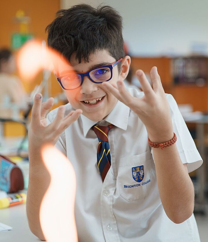  Excited pupil at Brighton College Vibhavadi participating in a science experiment, reflecting a love of learning in a top international school in Thailand. 
