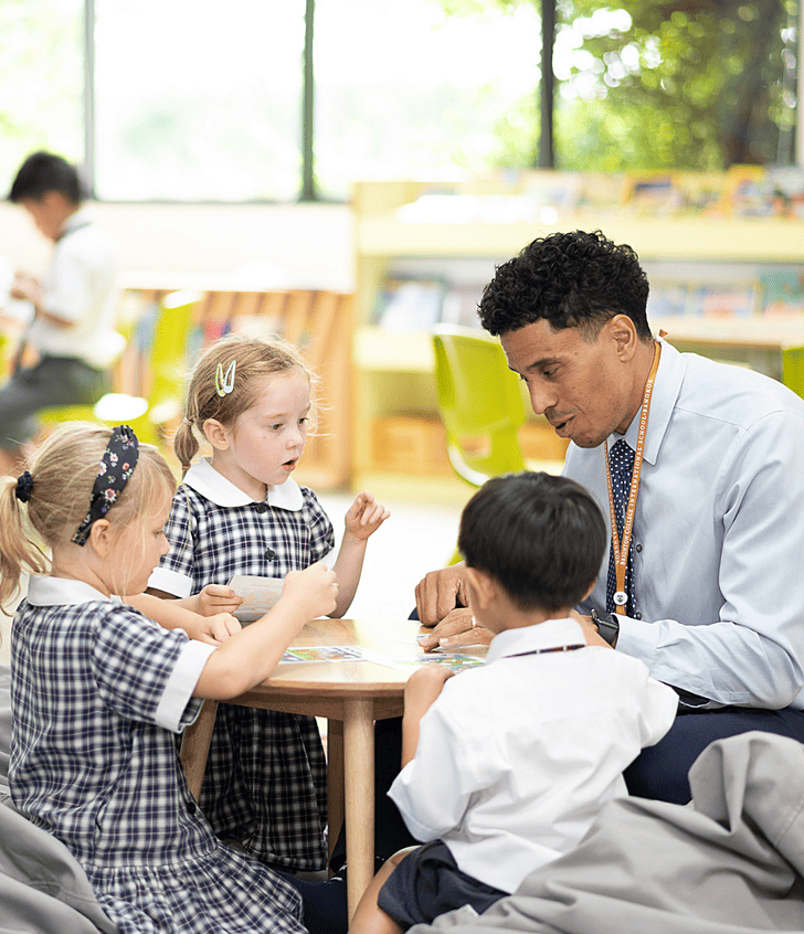  Brighton College Vibhavadi pupils and teacher joining together in a circle learning activity, highlighting a love of learning in a premium international school. 