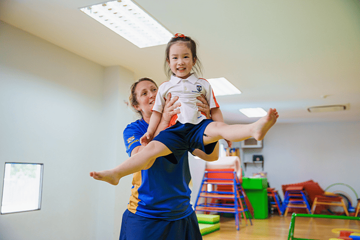 Pupil practicing yoga during after-school club at Brighton College Vibhavadi, supporting wellbeing at a premium international school in Bangkok. 
