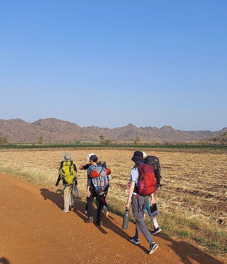  Pupils hiking toward the mountain at Brighton College Vibhavadi, building resilience and self-growth through purposeful outdoor learning. 