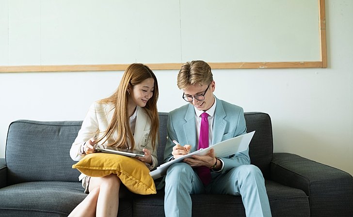  Sixth Form pupils at Brighton College Vibhavadi reading together, achieving academic success through collaboration and a future-ready learning environment. 