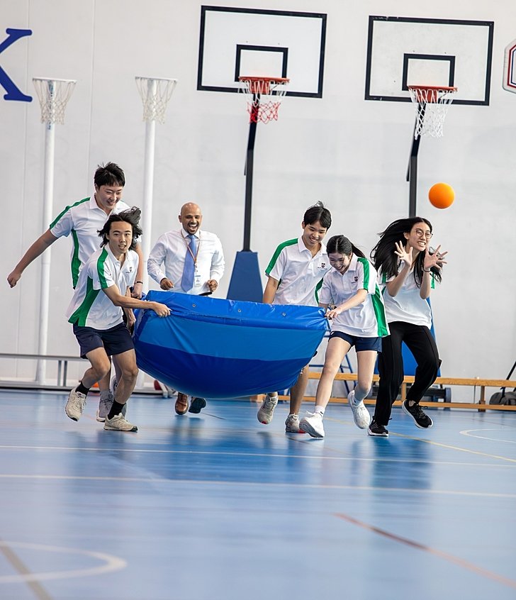  Sixth Form pupils playing a sport game at Brighton College Vibhavadi, balancing academic focus with physical wellbeing and teamwork. 