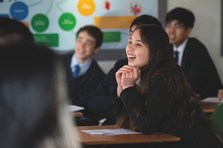  Pupil enjoying an engaging moment with a teacher at Brighton College Vibhavadi, where learning is joyful and relationships matter. 